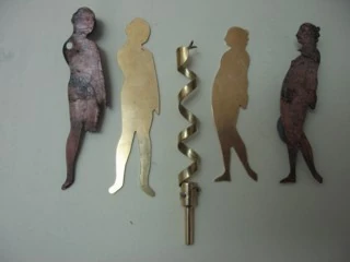 The new brass Adam, serpent and Eve, between the original painted figures they were copied from